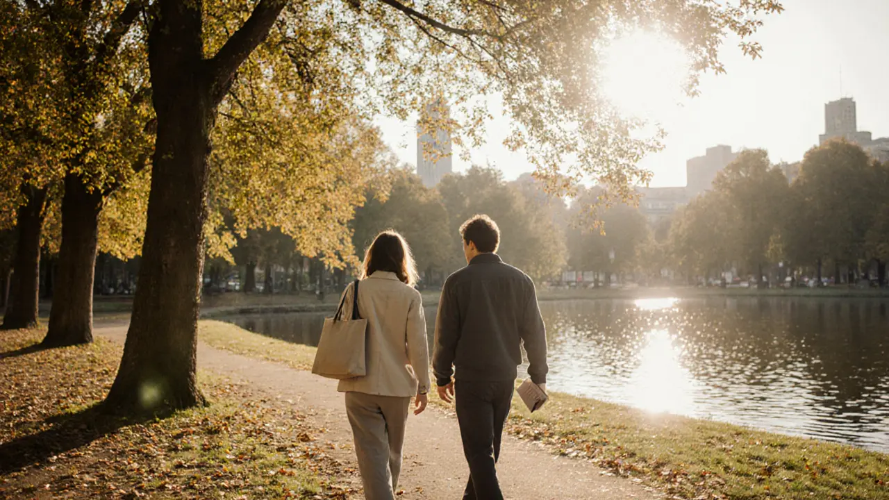 Two people walking peacefully together in Tiergarten park during autumn morning.